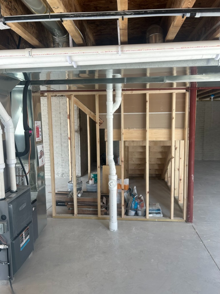 Basement drain piping and ductwork