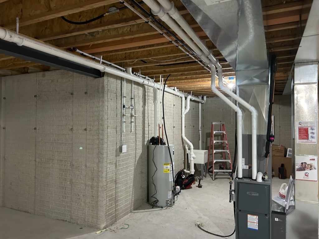 Side view of water heater and furnace installation