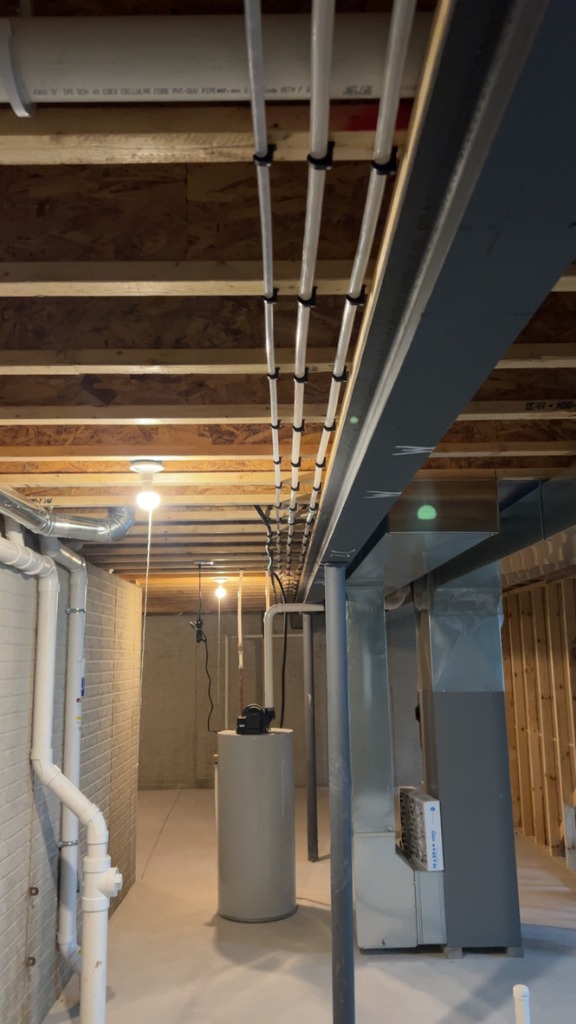 Vertical piping for water heater and furnace